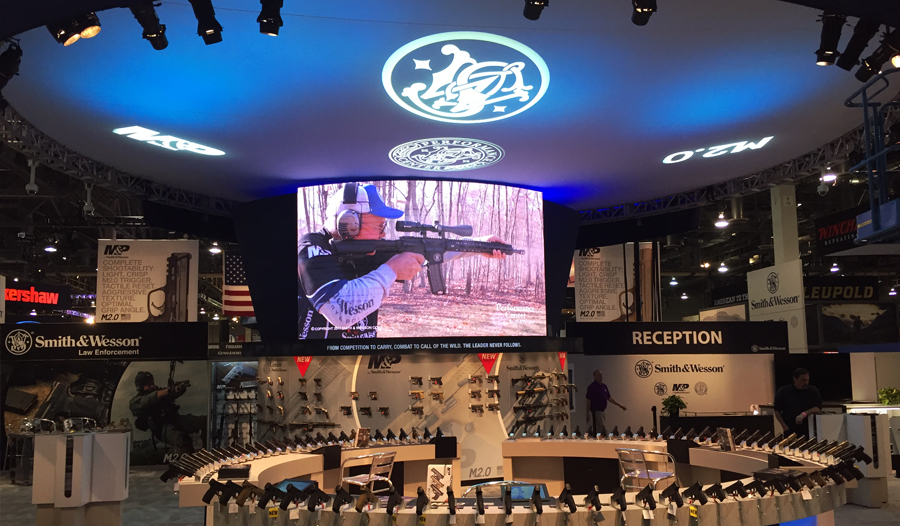 Smith and Wesson gave CS&L the honor, multiple times, of partnering with them on their trade show booths at the “SHOT SHOW”, held in Las Vegas each year. In 2017, they employed CS&L to implement a 3.9mm curved LED wall which was supported by the scenic display element directly below it. The 8’ X 15’ curved LED wall displayed their custom created content while elegantly enhancing a wider viewing angle for the booth attendees. Given the nature of the displayed products, a security camera system was implemented to which Smith and Wesson’s security partnered with CS&L during install through dismantling. All in all, this was a quality service for a quality client. 
